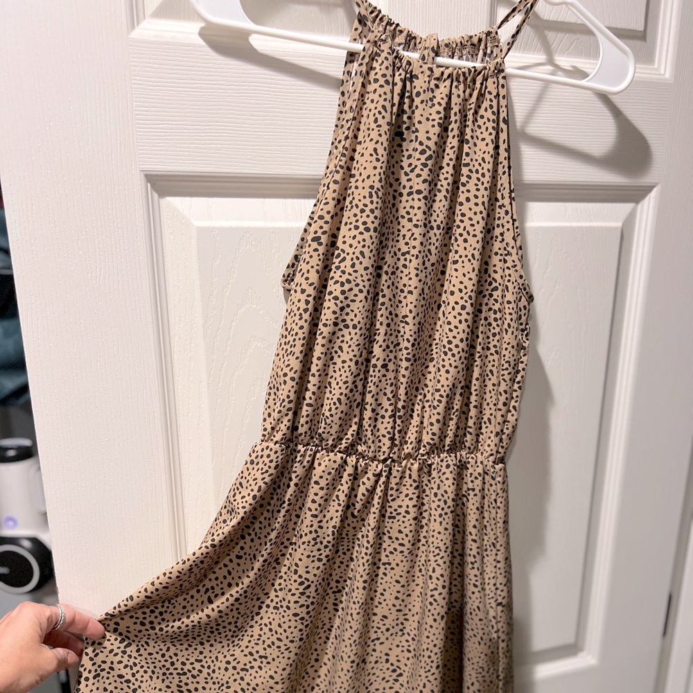 Tan with black spots, elastic waist with detail on bottom and drawstring neck.